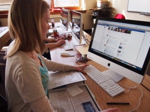 Molly Boylan, editor-in-chief at The Wood Word, reviews story budgets in the editors’ Facebook group after wrapping an editorial meeting. (Photo: Lindsey Wotanis)