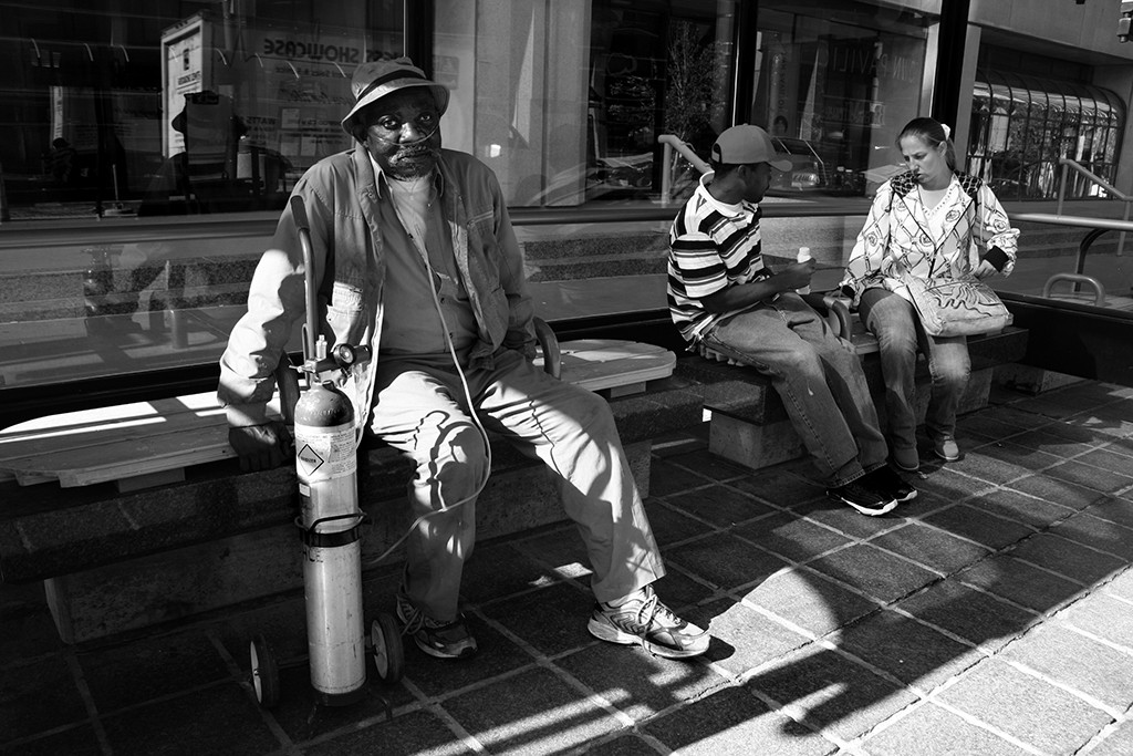 FIRST PLACE: Chantal Anderson, University of Washington (Kristin Millis, adviser) — John Elbit, a Kansas City senior citizen sits waiting to catch his bus. "I've lived here for the past 45 years, and I still love it," he said. A grandfather of six, living close to his family is most important to him.