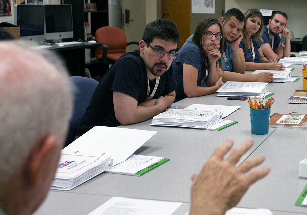 Students in the Dow Jones News Fund Center for Editing Excellence, including Vinny Vella (left), work as part of their internship workshop at the University of Texas. Photo by Bradley WIlson.