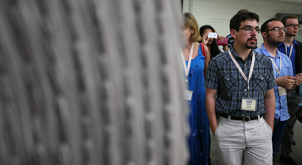 Vincent Vella of La Salle University listens during the tour of the post-production room. Vella will be doing his internship at The Denver Post. Austin American-Statesman, Thursday, May 24, 2012. Photo by Bradley Wilson